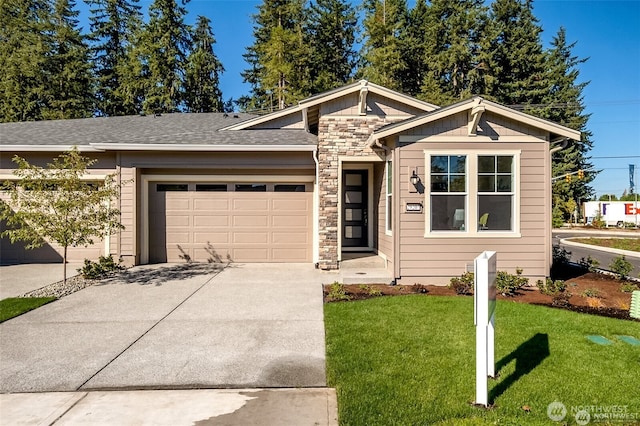 29207 217th Pl SE Unit 1, Black Diamond, WA 98010 - view of front of home featuring an attached garage, stone siding, concrete driveway, a front yard, and a shingled roof