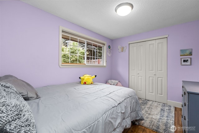 4709 144th St E, Tacoma, WA 98446 - bedroom featuring wood finished floors, a closet, and a textured ceiling