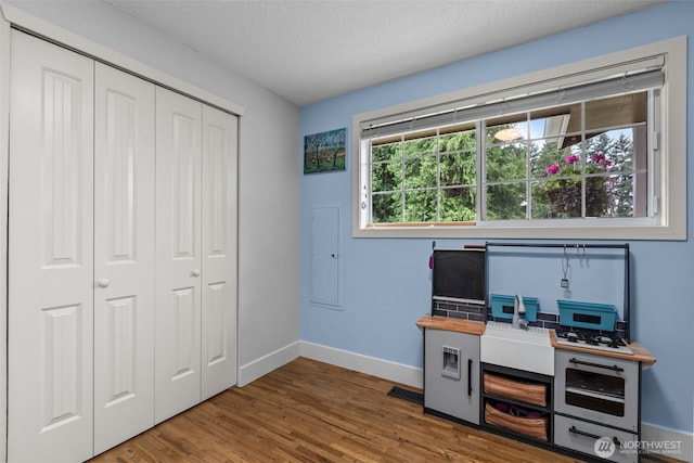 4709 144th St E, Tacoma, WA 98446 - office area with wood finished floors and a textured ceiling