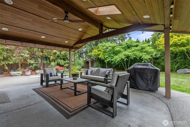 4709 144th St E, Tacoma, WA 98446 - fenced backyard with a grill, outdoor lounge area, a patio, and a ceiling fan