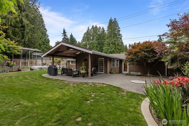 4709 144th St E, Tacoma, WA 98446 - rear view of house with a patio and an outdoor living space