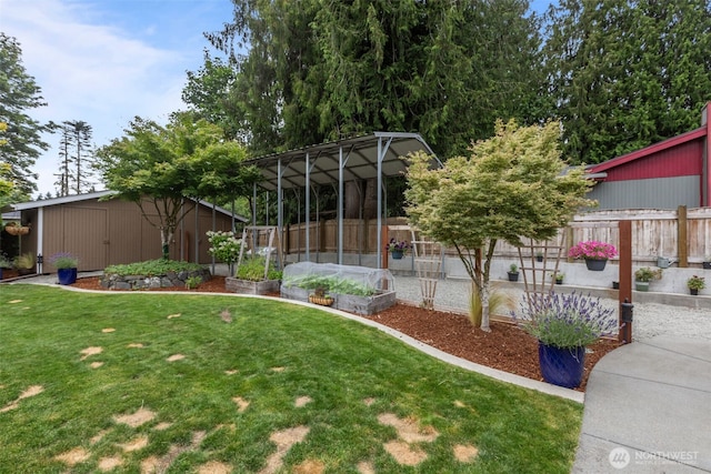 4709 144th St E, Tacoma, WA 98446 - view of yard featuring a vegetable garden and an outbuilding