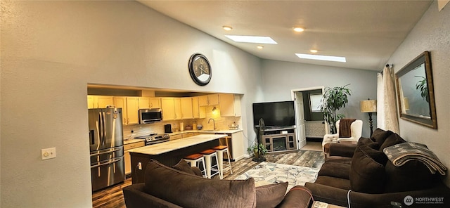 31505 46th Ave S, Auburn, WA 98001 - living room with dark wood finished floors, vaulted ceiling, and a skylight
