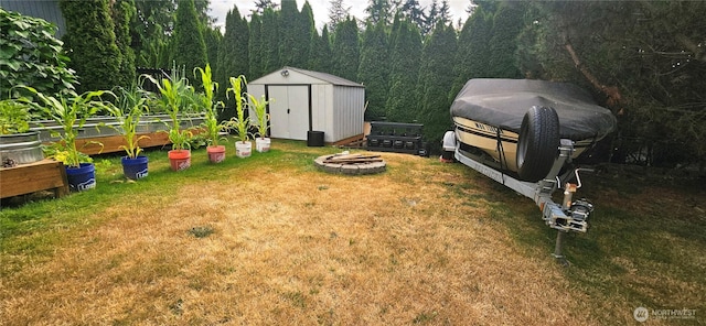 31505 46th Ave S, Auburn, WA 98001 - view of green lawn with a storage shed, a fire pit, and a garden