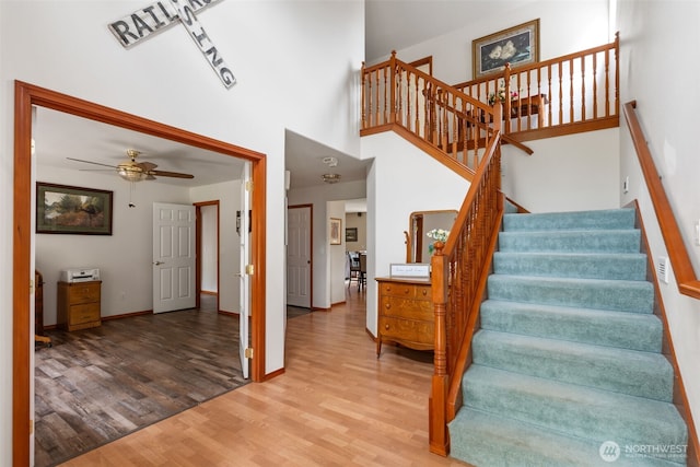 3517 Frogs Leap Ln NE, Olympia, WA 98506 - stairs with wood finished floors, a towering ceiling, and ceiling fan