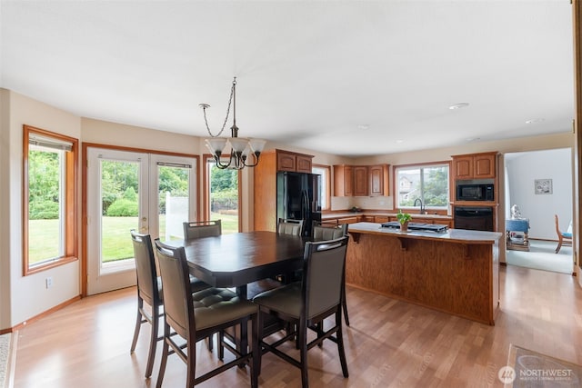 3517 Frogs Leap Ln NE, Olympia, WA 98506 - dining space with light wood-style flooring, a chandelier, and recessed lighting