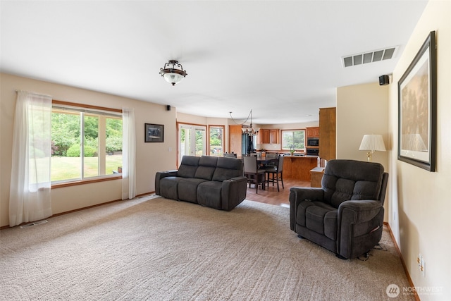 3517 Frogs Leap Ln NE, Olympia, WA 98506 - carpeted living area with a chandelier and baseboards