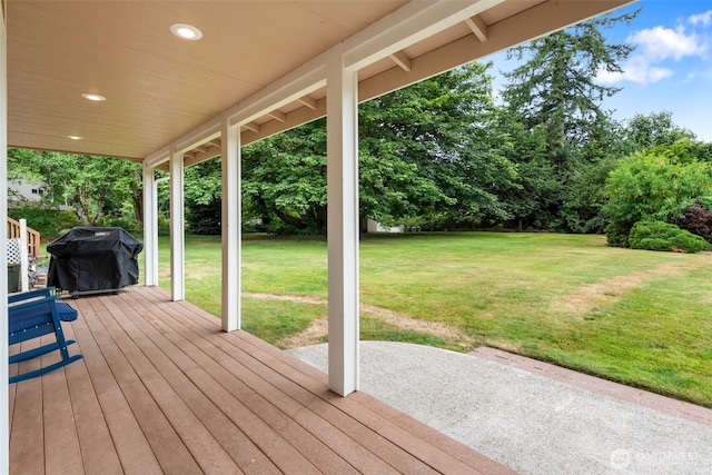 3517 Frogs Leap Ln NE, Olympia, WA 98506 - wooden terrace featuring a grill, a lawn, view of wooded area, and a patio area