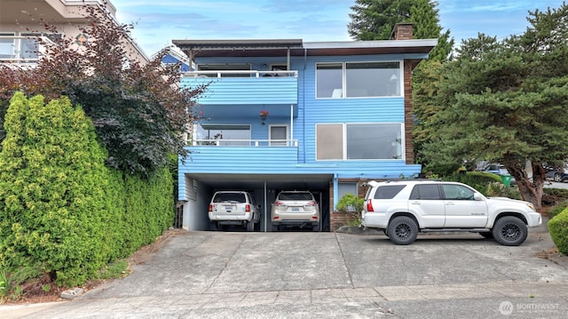 1001 1st Ave N, Seattle, WA 98109 - view of front of home with a chimney and a carport