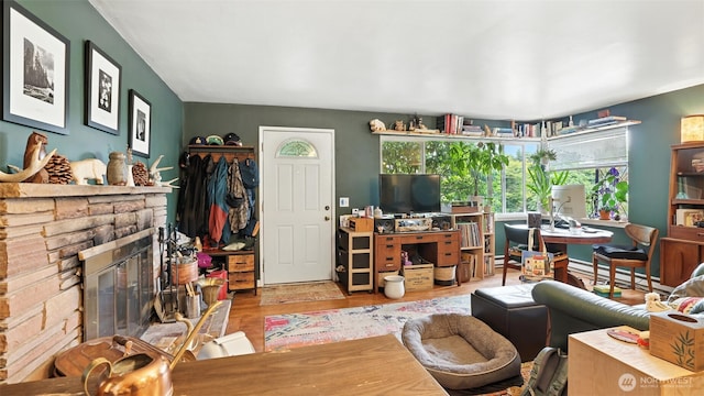 1001 1st Ave N, Seattle, WA 98109 - living area with plenty of natural light, wood finished floors, a fireplace, and a baseboard radiator