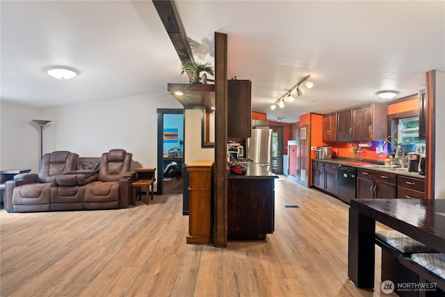 5818 Everson Goshen, Bellingham, WA 98226 - kitchen with black dishwasher, light wood-type flooring, freestanding refrigerator, track lighting, and open floor plan