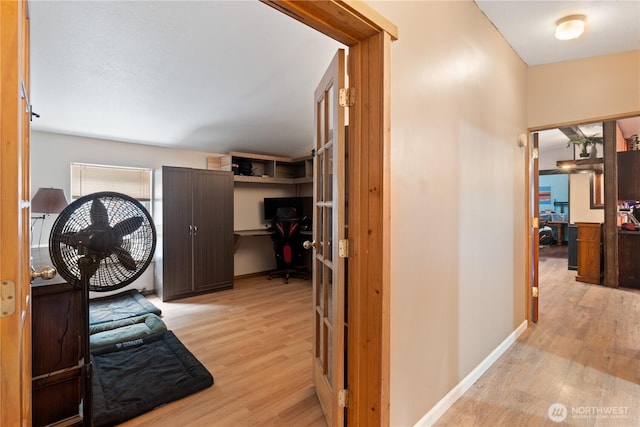 5818 Everson Goshen, Bellingham, WA 98226 - hallway with light wood-style floors, an office area, and french doors