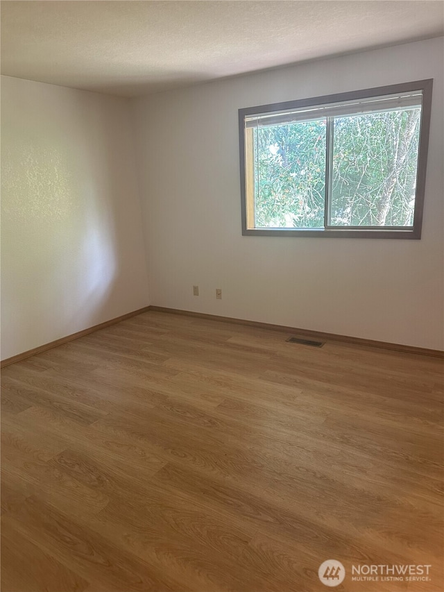 1430 Welling Rd, Bellingham, WA 98226 - empty room featuring wood finished floors and baseboards