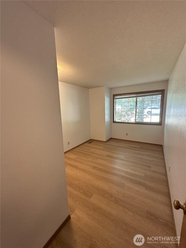 1430 Welling Rd, Bellingham, WA 98226 - empty room with light wood-style floors and baseboards