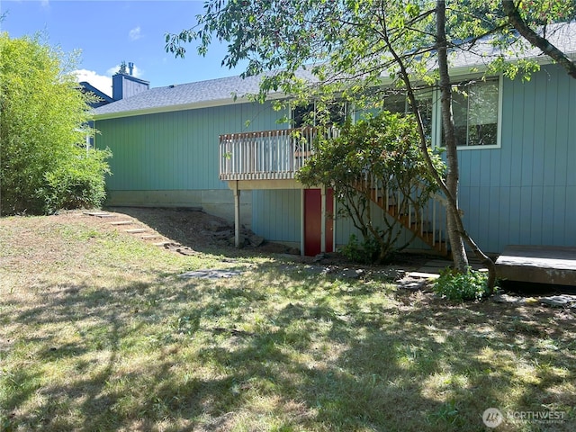 1430 Welling Rd, Bellingham, WA 98226 - rear view of property with a lawn, a deck, and a chimney