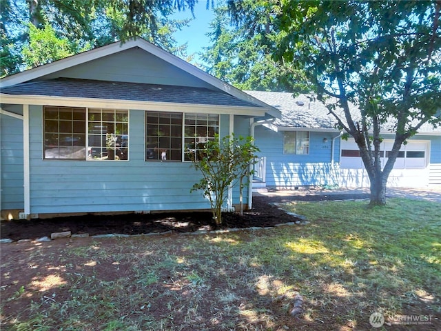 1430 Welling Rd, Bellingham, WA 98226 - ranch-style house with a garage, roof with shingles, and a front lawn