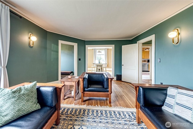 1008 W 5th St N, Port Angeles, WA 98363 - living room featuring wood finished floors and ornamental molding