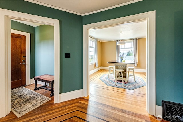 1008 W 5th St N, Port Angeles, WA 98363 - dining area featuring crown molding and wood finished floors
