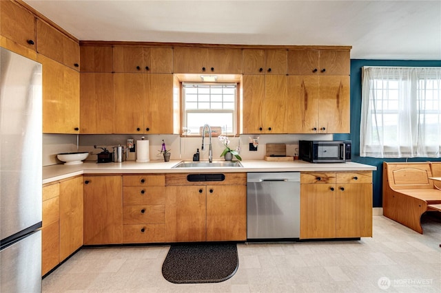 1008 W 5th St N, Port Angeles, WA 98363 - kitchen with stainless steel appliances, plenty of natural light, light countertops, and light flooring