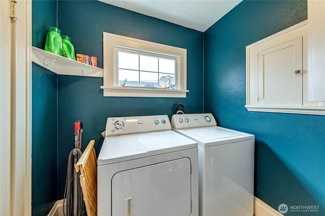 1008 W 5th St N, Port Angeles, WA 98363 - washroom featuring washer and clothes dryer and cabinet space