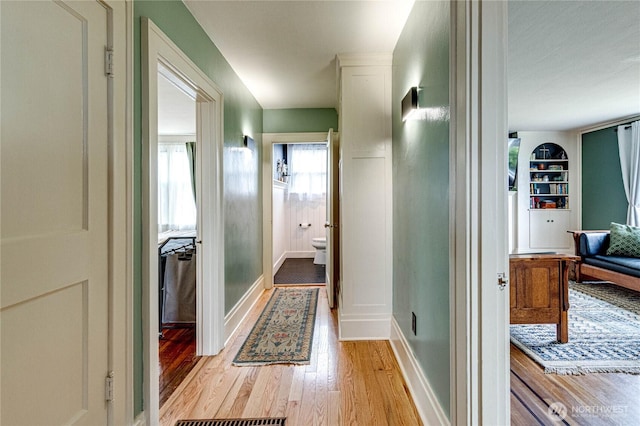 1008 W 5th St N, Port Angeles, WA 98363 - hallway featuring light wood finished floors and built in shelves