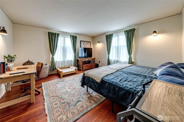 1008 W 5th St N, Port Angeles, WA 98363 - bedroom featuring wood finished floors and multiple windows