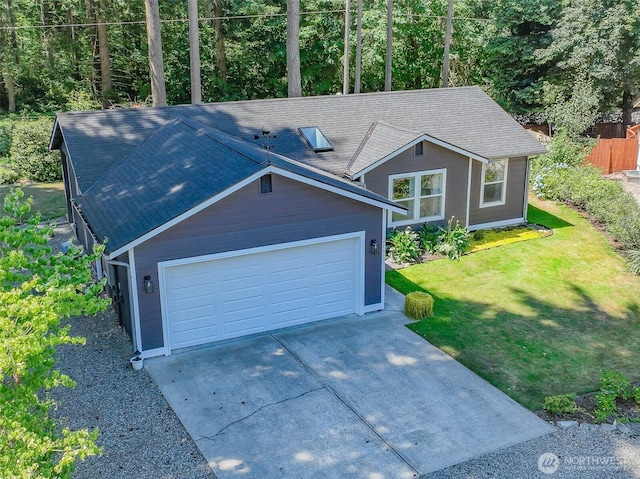 17701 Vine Ln SE, Yelm, WA 98597 - view of front of property with a front lawn, an attached garage, concrete driveway, and roof with shingles