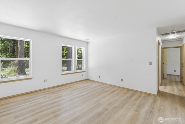 17701 Vine Ln SE, Yelm, WA 98597 - spare room with healthy amount of natural light and light wood-style floors