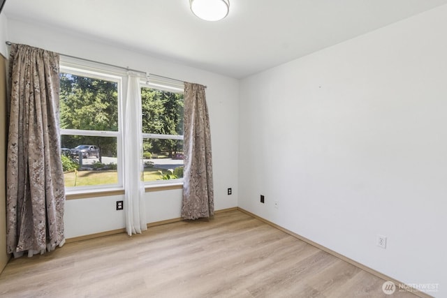 17701 Vine Ln SE, Yelm, WA 98597 - unfurnished room featuring light wood-style flooring and baseboards