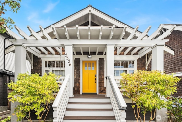 5526 34th Ave NE, Seattle, WA 98105 - view of front of property with stone siding and a porch