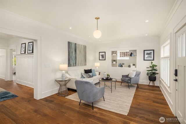 5526 34th Ave NE, Seattle, WA 98105 - living area with built in features, ornamental molding, wood finished floors, and recessed lighting