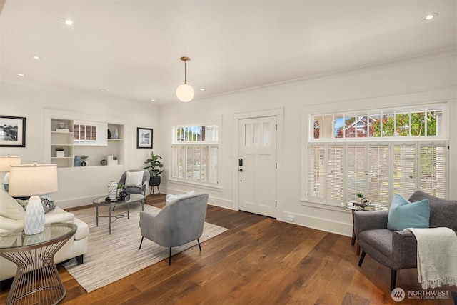5526 34th Ave NE, Seattle, WA 98105 - living room with dark wood finished floors, crown molding, recessed lighting, and built in features