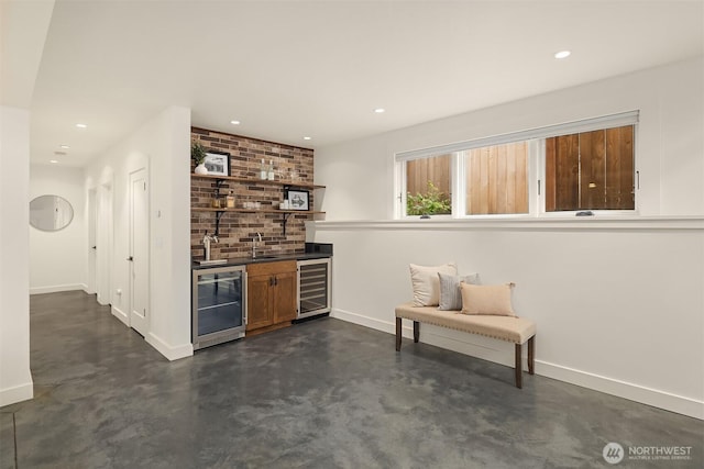 5526 34th Ave NE, Seattle, WA 98105 - indoor wet bar with beverage cooler, finished concrete floors, and recessed lighting