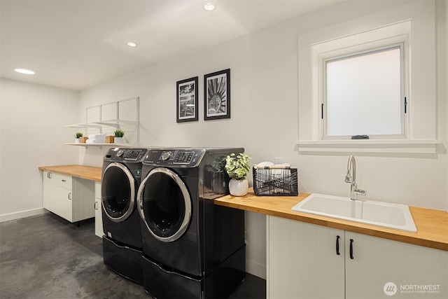 5526 34th Ave NE, Seattle, WA 98105 - laundry area featuring washing machine and dryer, recessed lighting, and cabinet space