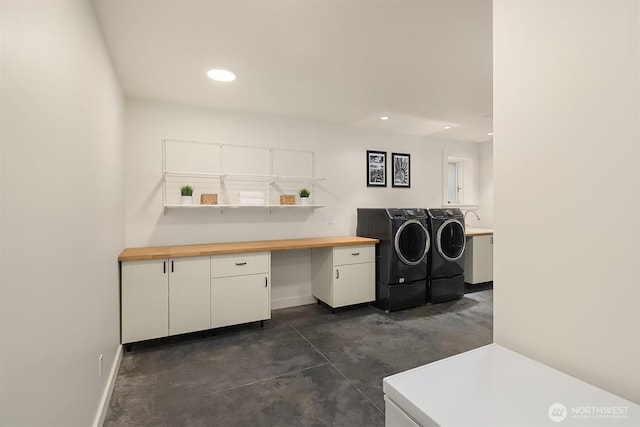 5526 34th Ave NE, Seattle, WA 98105 - washroom featuring washer and clothes dryer, cabinet space, recessed lighting, and an office area