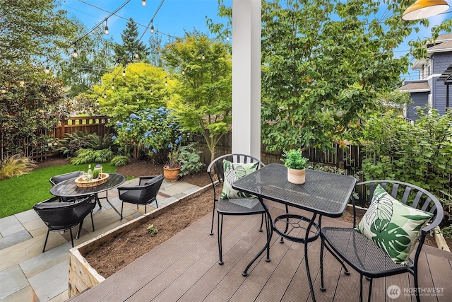 5526 34th Ave NE, Seattle, WA 98105 - fenced backyard with outdoor dining space and a deck