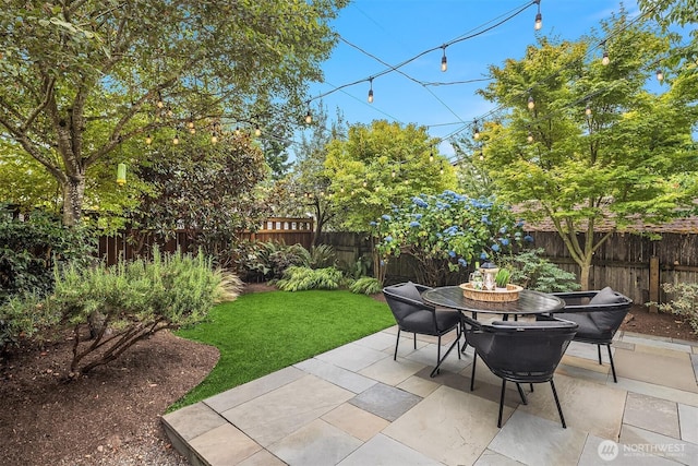 5526 34th Ave NE, Seattle, WA 98105 - fenced backyard featuring outdoor dining space and a patio