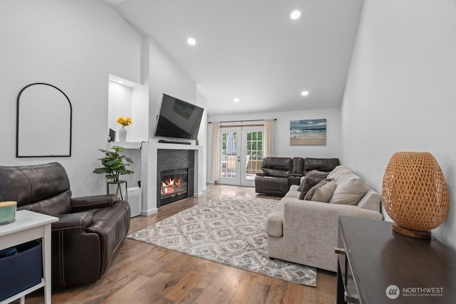 37509 21st Ave S, Federal Way, WA 98003 - living area featuring lofted ceiling, french doors, wood finished floors, recessed lighting, and a glass covered fireplace