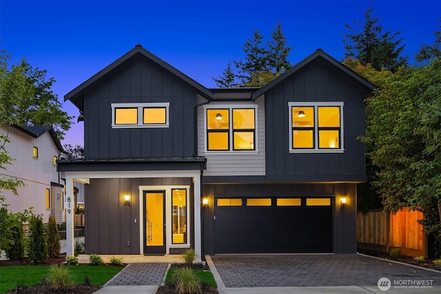819 18th Ave W, Kirkland, WA 98033 - view of front of property with a garage, board and batten siding, and driveway