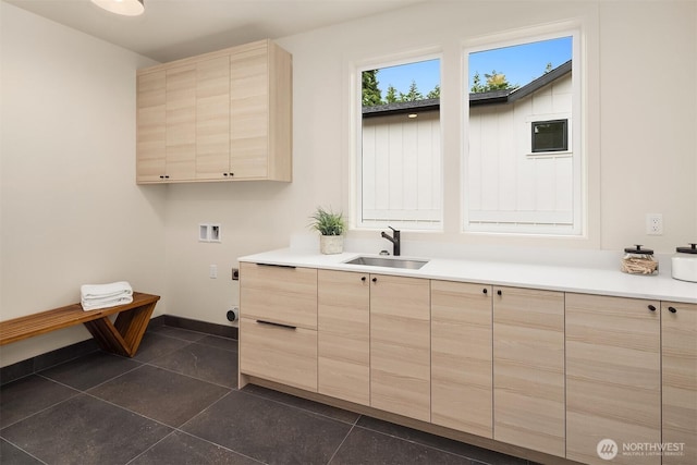 819 18th Ave W, Kirkland, WA 98033 - laundry area with cabinet space, washer hookup, hookup for an electric dryer, and dark tile patterned floors