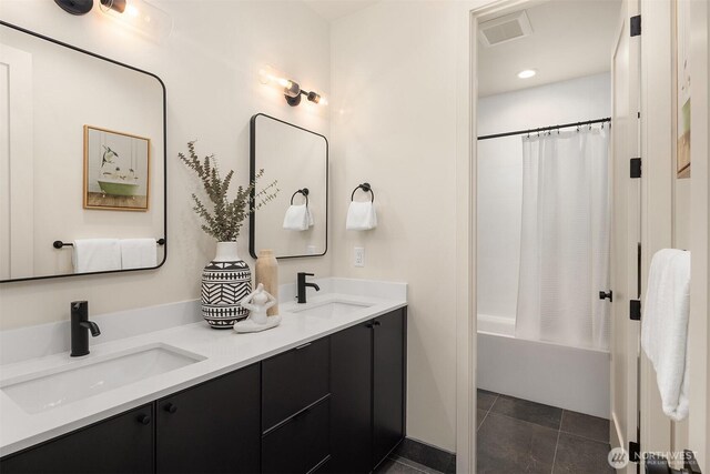 819 18th Ave W, Kirkland, WA 98033 - full bathroom with double vanity, shower / bath combination with curtain, and tile patterned flooring