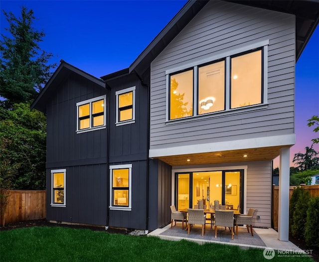 819 18th Ave W, Kirkland, WA 98033 - rear view of property featuring a patio and board and batten siding