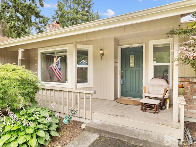 6908 254th St E, Graham, WA 98338 - entrance to property with a chimney and a porch