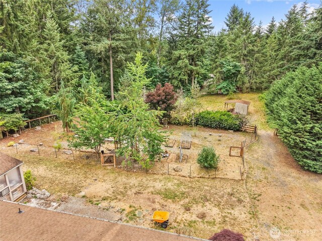6908 254th St E, Graham, WA 98338 - view of yard featuring a garden