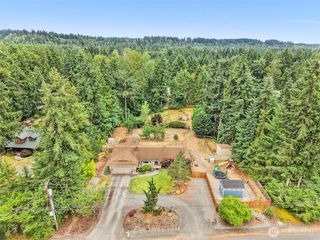 6908 254th St E, Graham, WA 98338 - aerial view of property and surrounding area featuring a heavily wooded area
