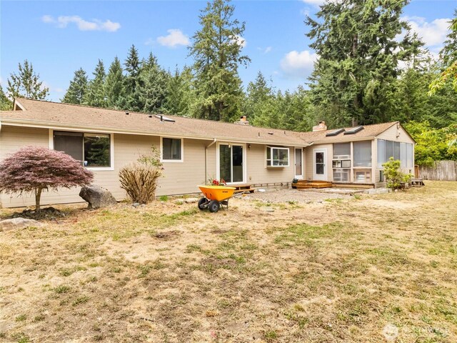 6908 254th St E, Graham, WA 98338 - rear view of house featuring a sunroom
