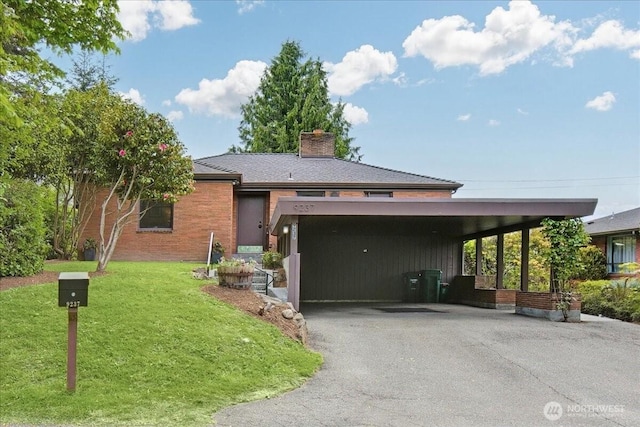9237 24th Ave NW, Seattle, WA 98117 - view of front facade with driveway, a front yard, a chimney, an attached carport, and brick siding