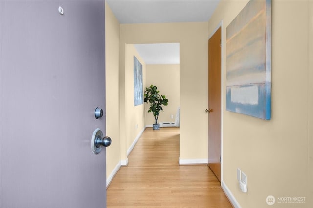 9237 24th Ave NW, Seattle, WA 98117 - corridor with light wood-style floors and baseboard heating