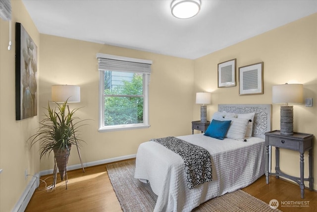 9237 24th Ave NW, Seattle, WA 98117 - bedroom with a baseboard radiator and wood finished floors