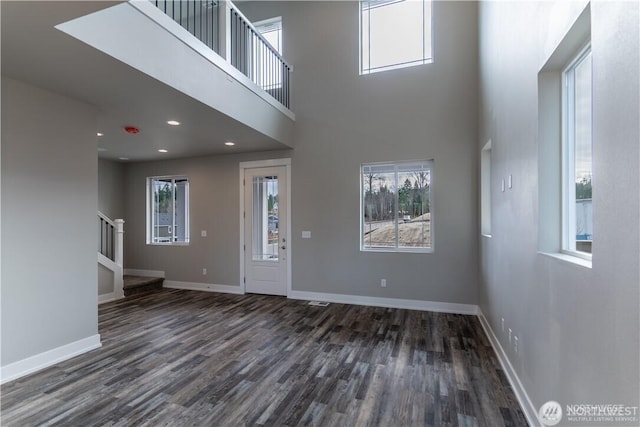 18911 Eagle Ridge Dr E Unit Lt527, Bonney Lake, WA 98391 - unfurnished living room featuring dark wood finished floors, stairway, recessed lighting, and a high ceiling